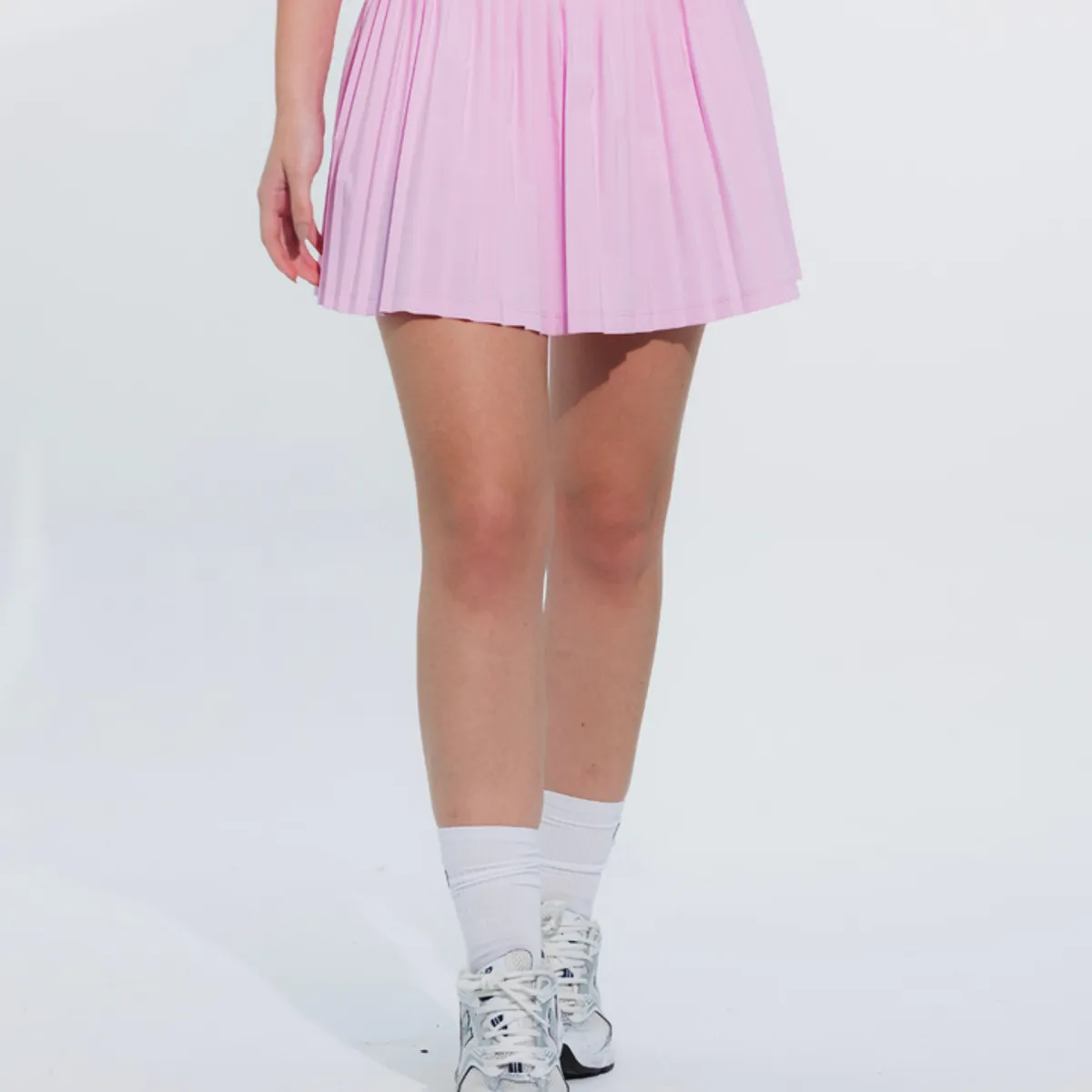 NO RULES - FALDA SHORT DEPORTIVA PLEAT ROSADA.