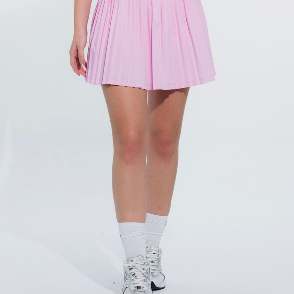 NO RULES - FALDA SHORT DEPORTIVA PLEAT ROSADA.