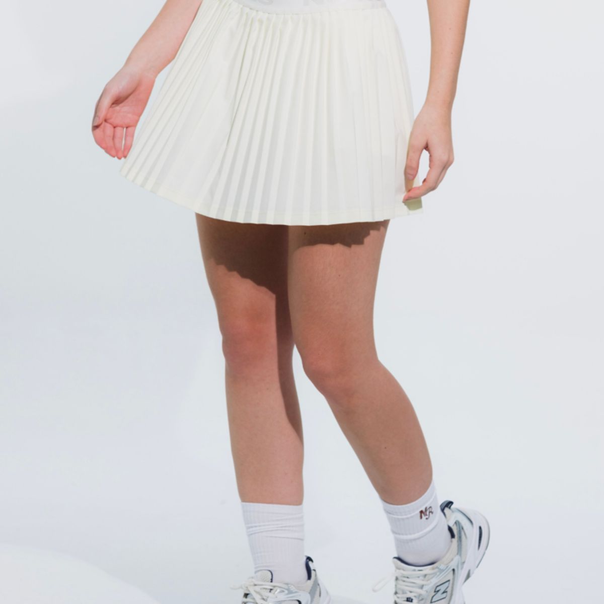 NO RULES - FALDA SHORT DEPORTIVA PLEAT MARFIL.