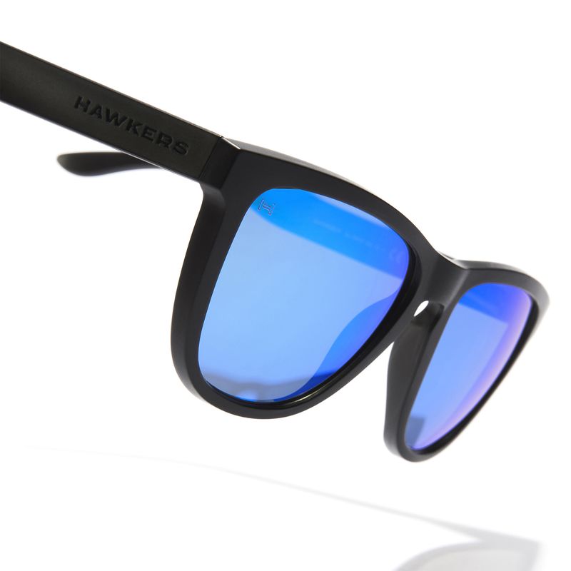 HAWKERS - Gafas de Sol Polarizadas Hawkers Hombre y Mujer ONE RAW AzulNegro