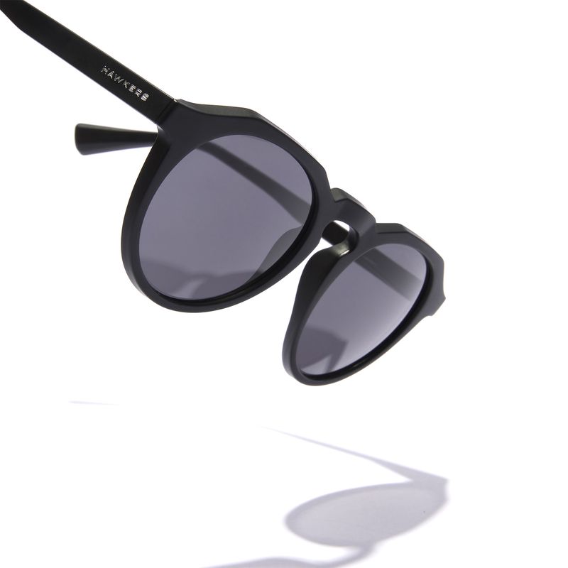 HAWKERS - Gafas de Sol Hawkers Hombre y Mujer  WARWICK RAW Negro