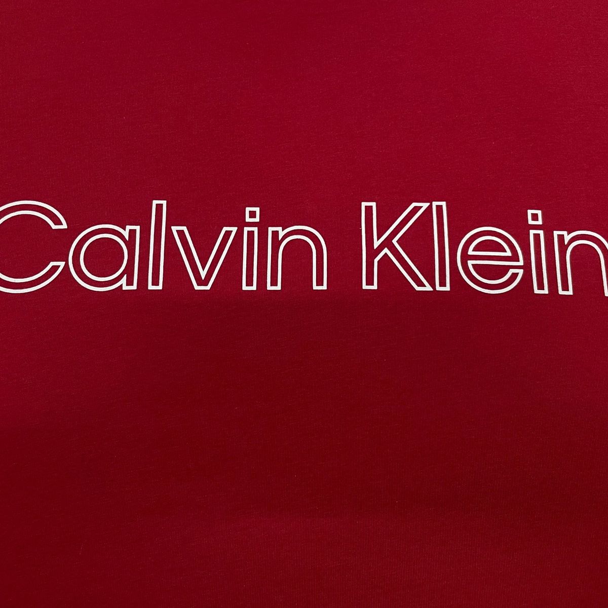 CALVIN KLEIN - Camiseta rosada con logo traveling Calvin Klein