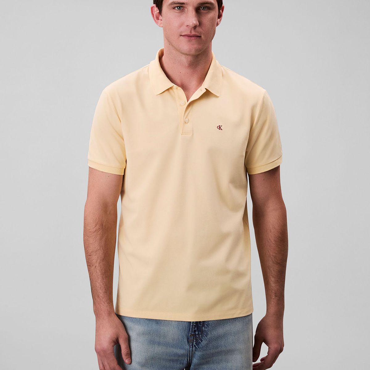 CALVIN KLEIN - Polo amarillo con monograma bordado Calvin Klein
