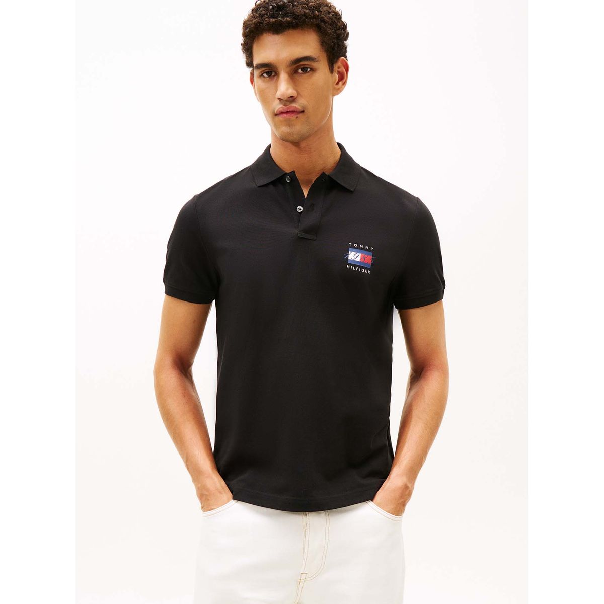 TOMMY HILFIGER - Polo negro de corte regular con logo gráfico Tommy Hilfiger