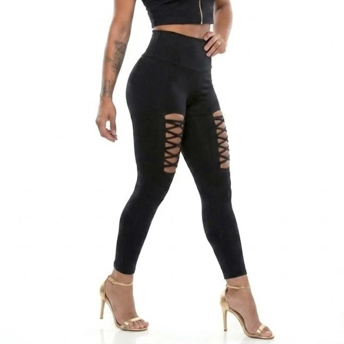 VIA7 - ¡Estilo que Atrapa Leggings Negros con Cortes Entrelazados de Alta Moda