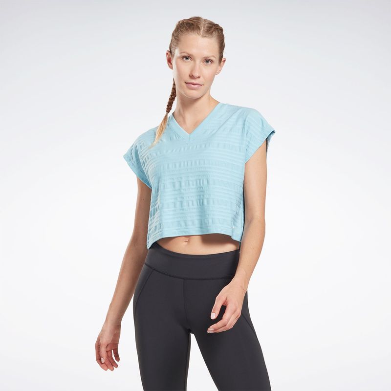REEBOK - Camiseta Deportiva Cuello en V para Mujer Reebok