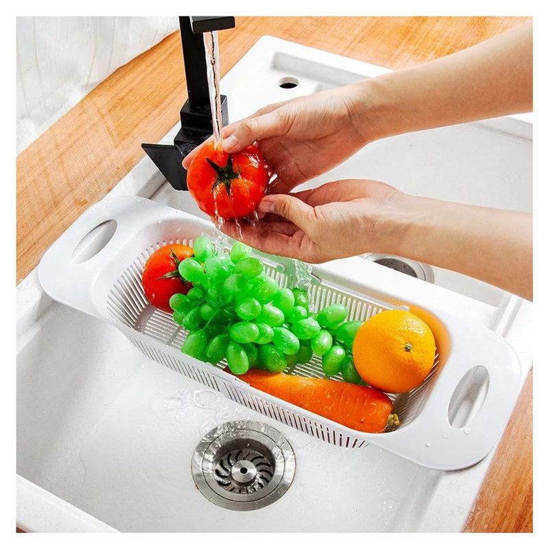 GENERICO - Escurridor retráctil sobre el lavadero frutas verduras vasos cubiertos