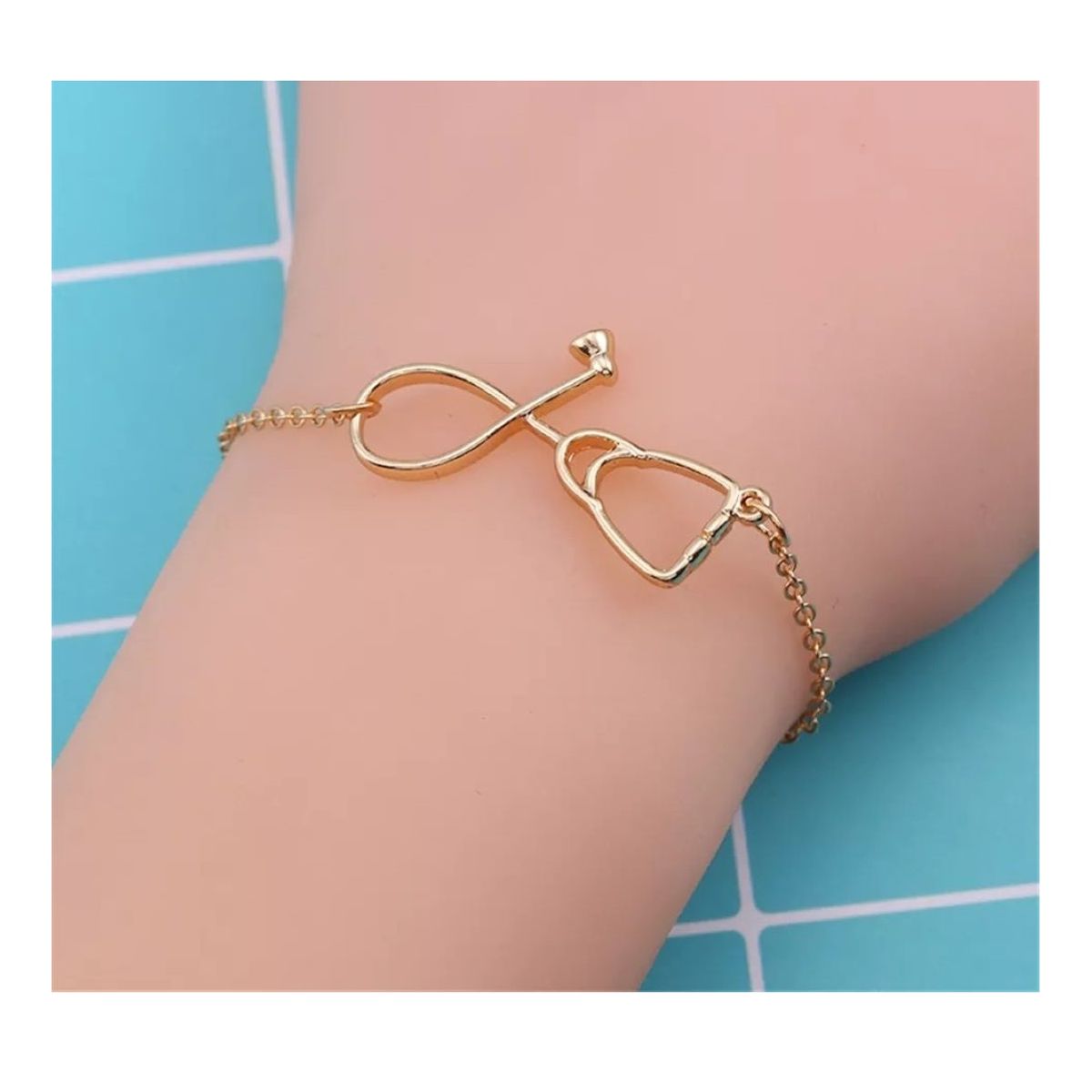 GENERICO - Pulsera estetoscopio dorada medicina