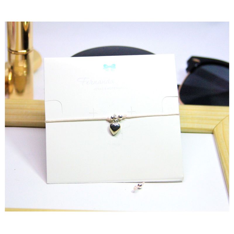 FERNANDA ROMERO JOYAS Y ACCESORIOS - Pulsera TODO AMOR - Corazón de Plata Ley Tejida con Hilo Rosada