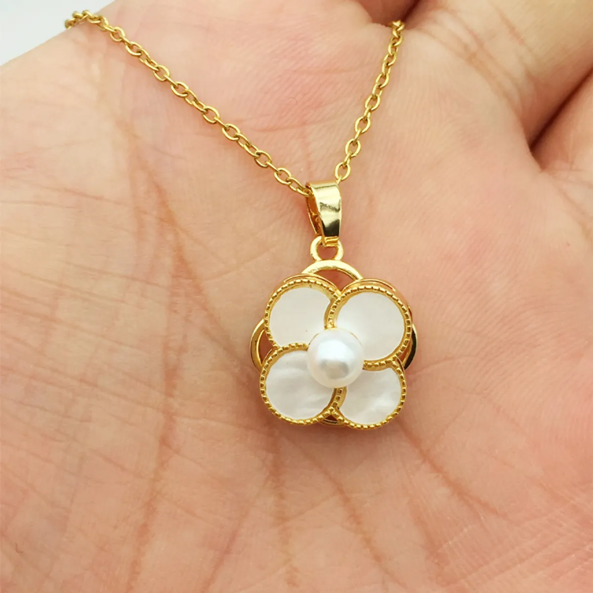 GENERICO - Collar giratorio trebol cuatro hojas con perla