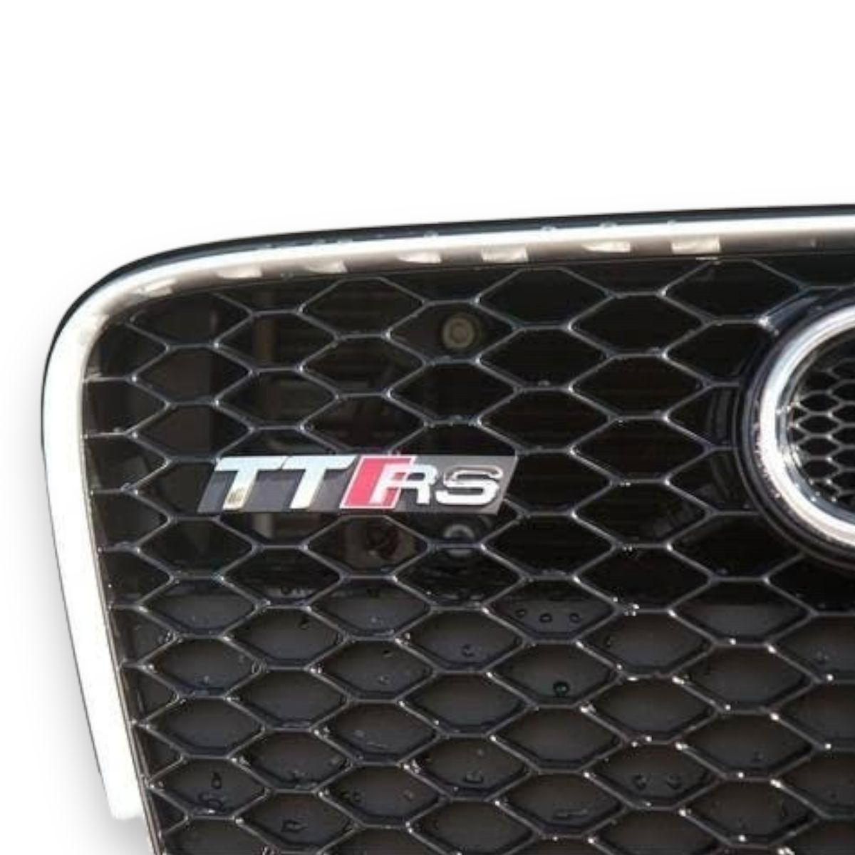 GENERICO - EMBLEMA DE PARRIILA TTRS PARA AUDI