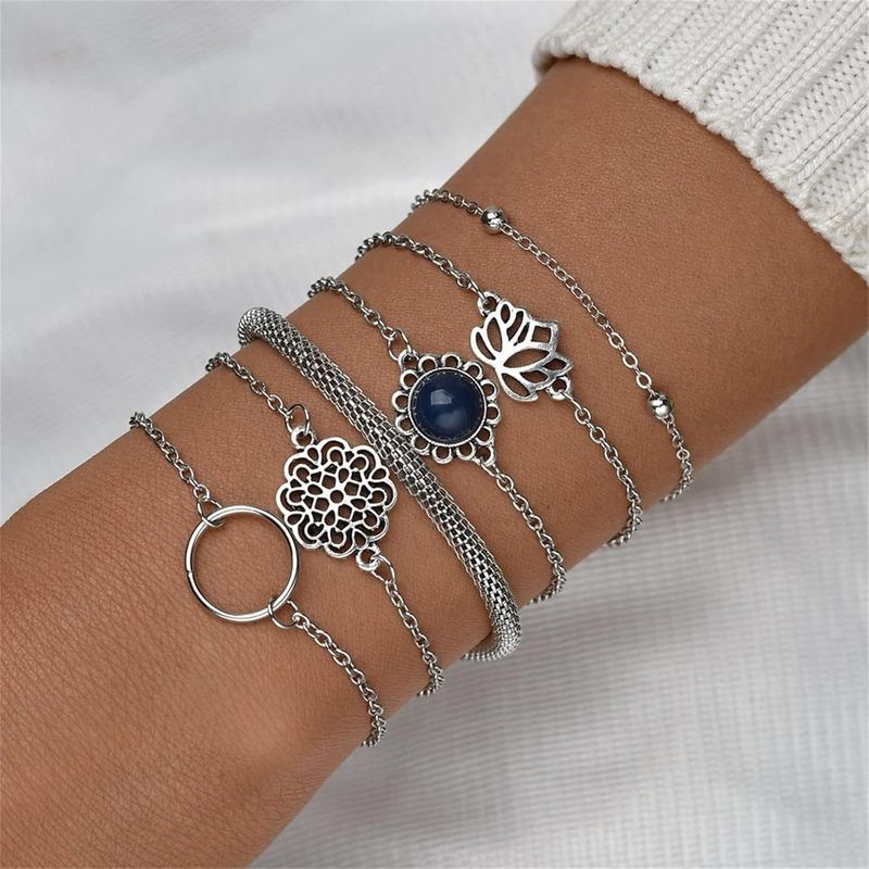 GENERICO - Set x 6 pulseras plateadas flor de loto para mujer