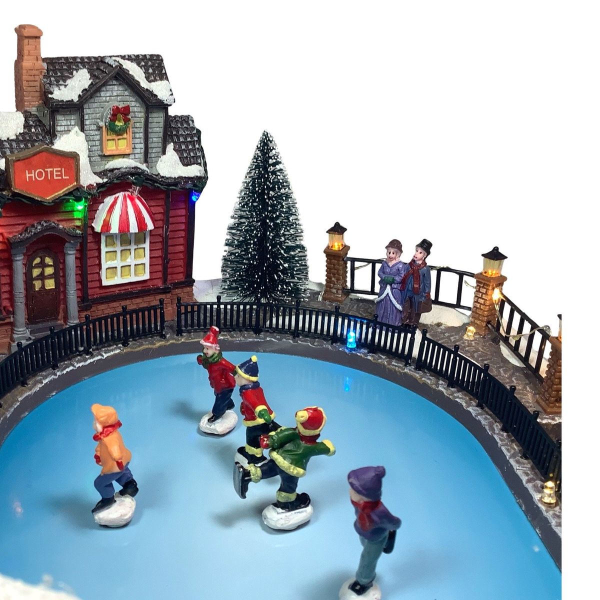 GENERICO - Villa navideña con pista de nieve 5 muñecos estilo europeo