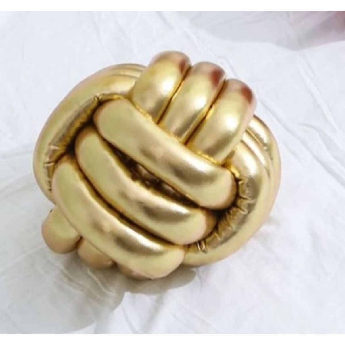 GENERICO - Cojín nudo en color dorado metálico Brillante