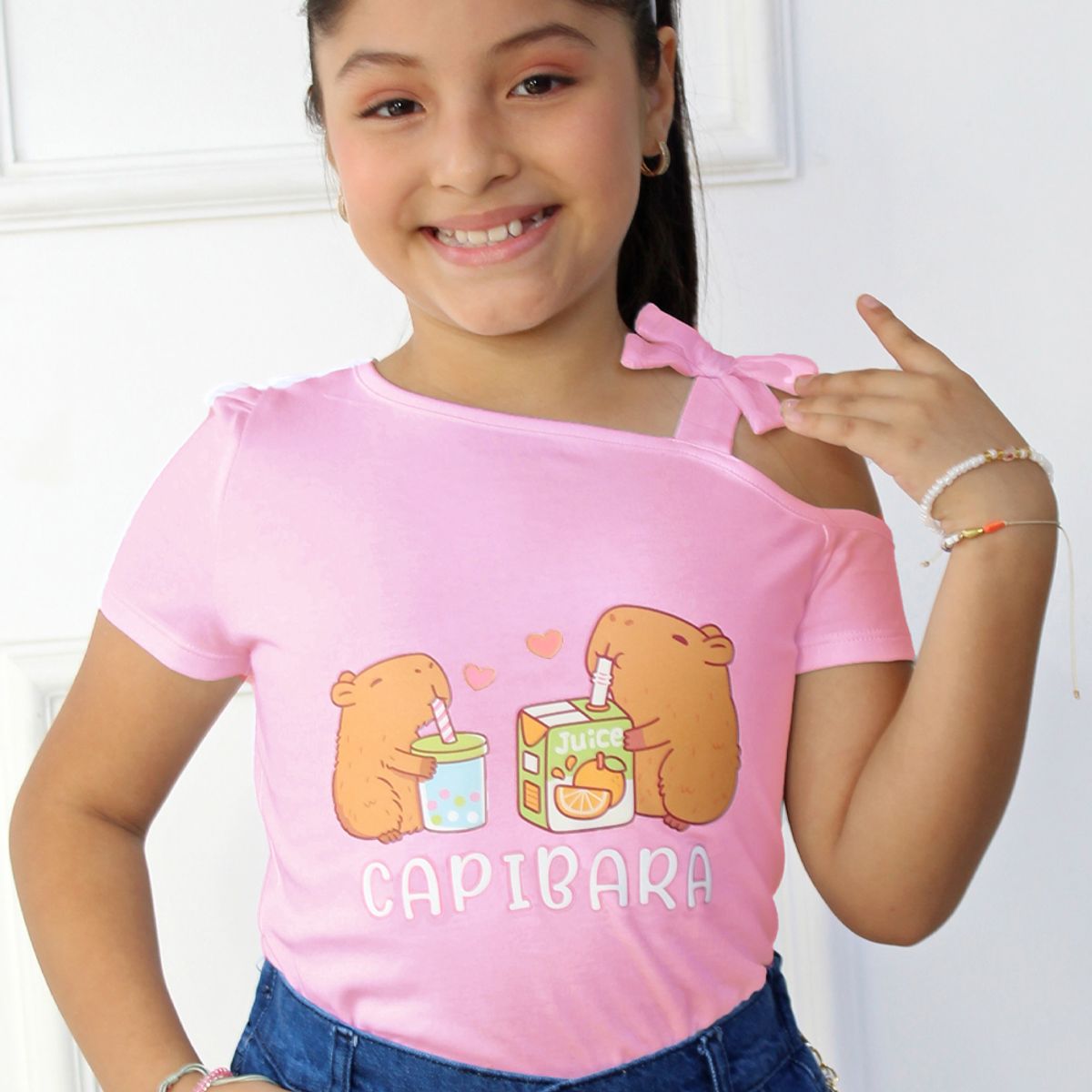 KIDS MASHMELO - POLO PARA NIÑA ASIMETRICO ESTAMPADO DE CAPIBARA KIDS MASHMELO