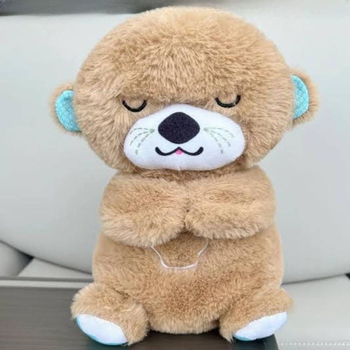 GENERICO - PELUCHE MUSICAL HIPOALERGÉNICO LUZ RELAJANTE RESPIRACIÓN NUTRIA BEIGE