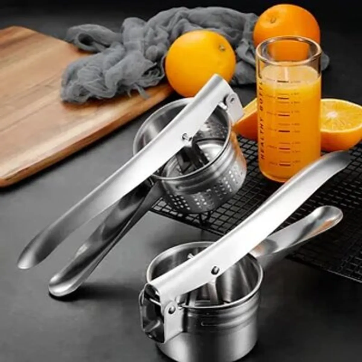 GENERICO - EXPRIMIDOR DE ACERO INOXIDABLE