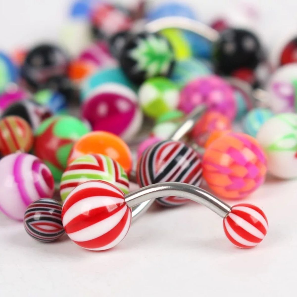 GENERICO - Set x 3 piercings para ombligo colores al azar