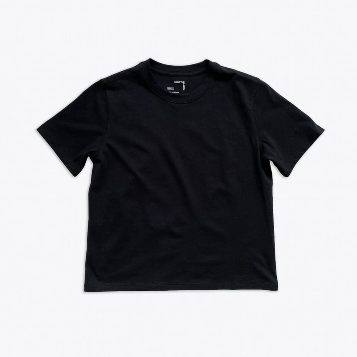 DROP THE LABEL - Polo Boxy Negro para Mujer Drop the Label Cuello Redondo Manga Corta Algodón