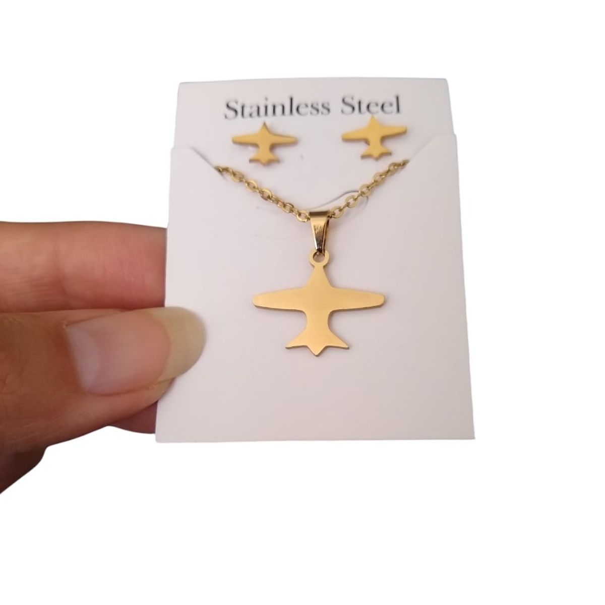 GENERICO - Set collar y aretes avión dorado viaje