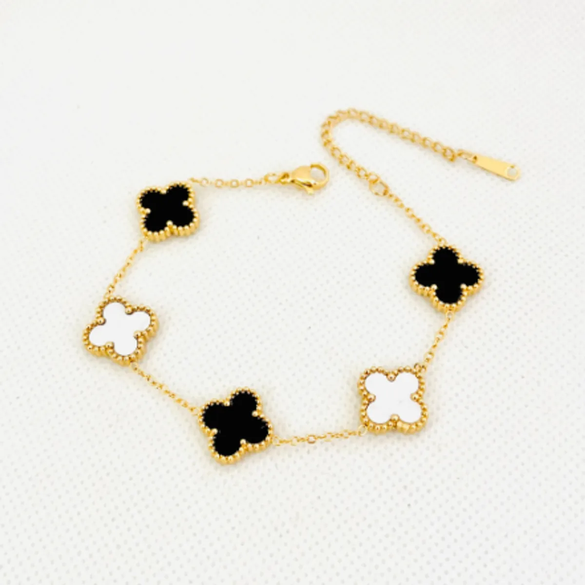 GENERICO - Pulsera de acero trébol nacarado blanco y negro