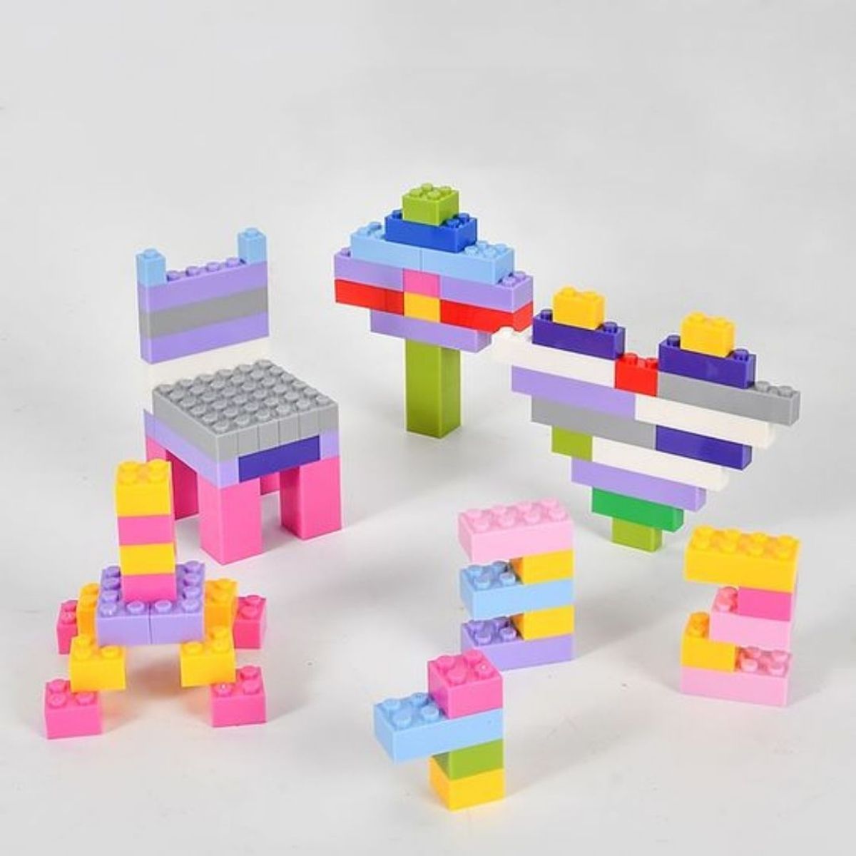 GENERICO - Bloques Educativos Balde con Tapa de Reloj - 100 Pzs - Niñas