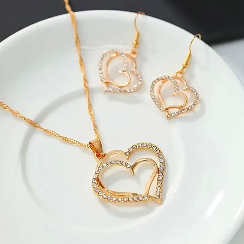 GENERICO - Collar y aretes corazon dorado