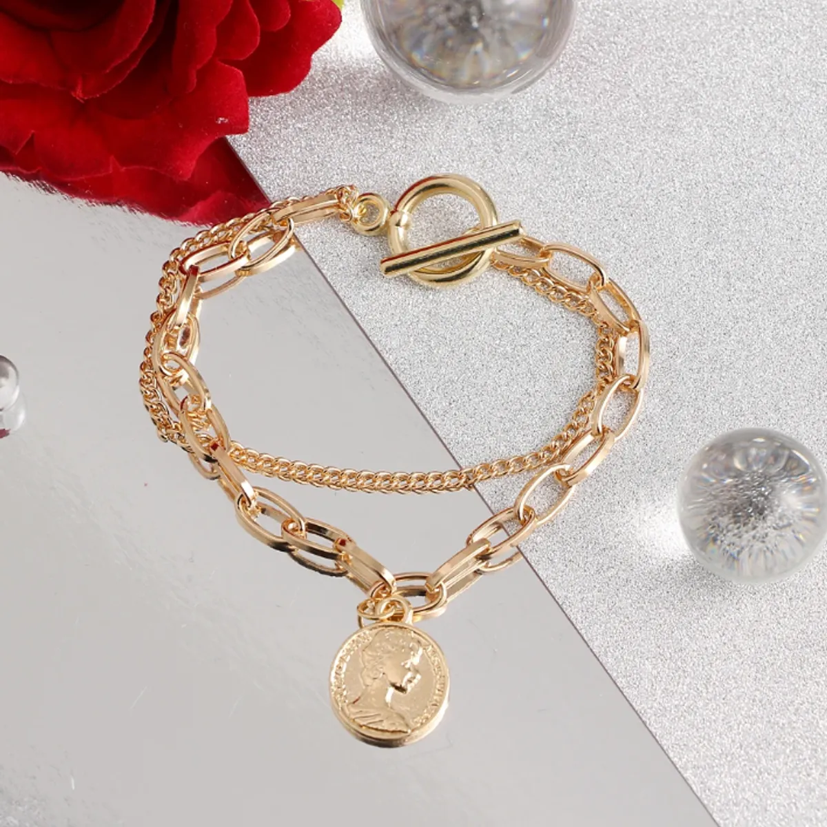 GENERICO - Set de pulseras doradas modelo monera  juego de 2 piezas