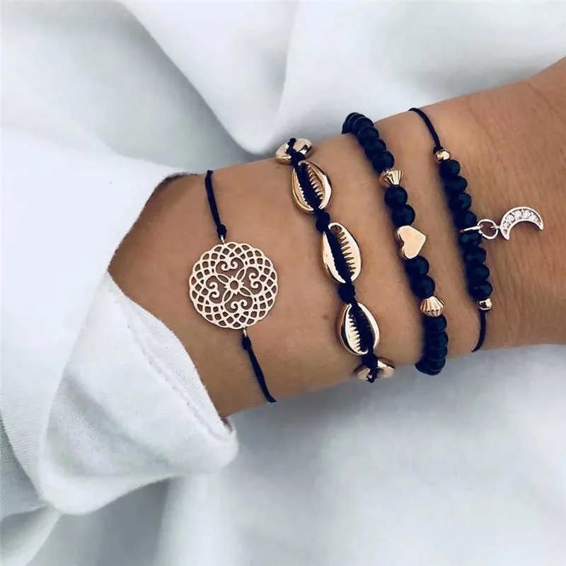 GENERICO - Set x 4 pulseras doradas y negro para mujer corazón luna conchitas