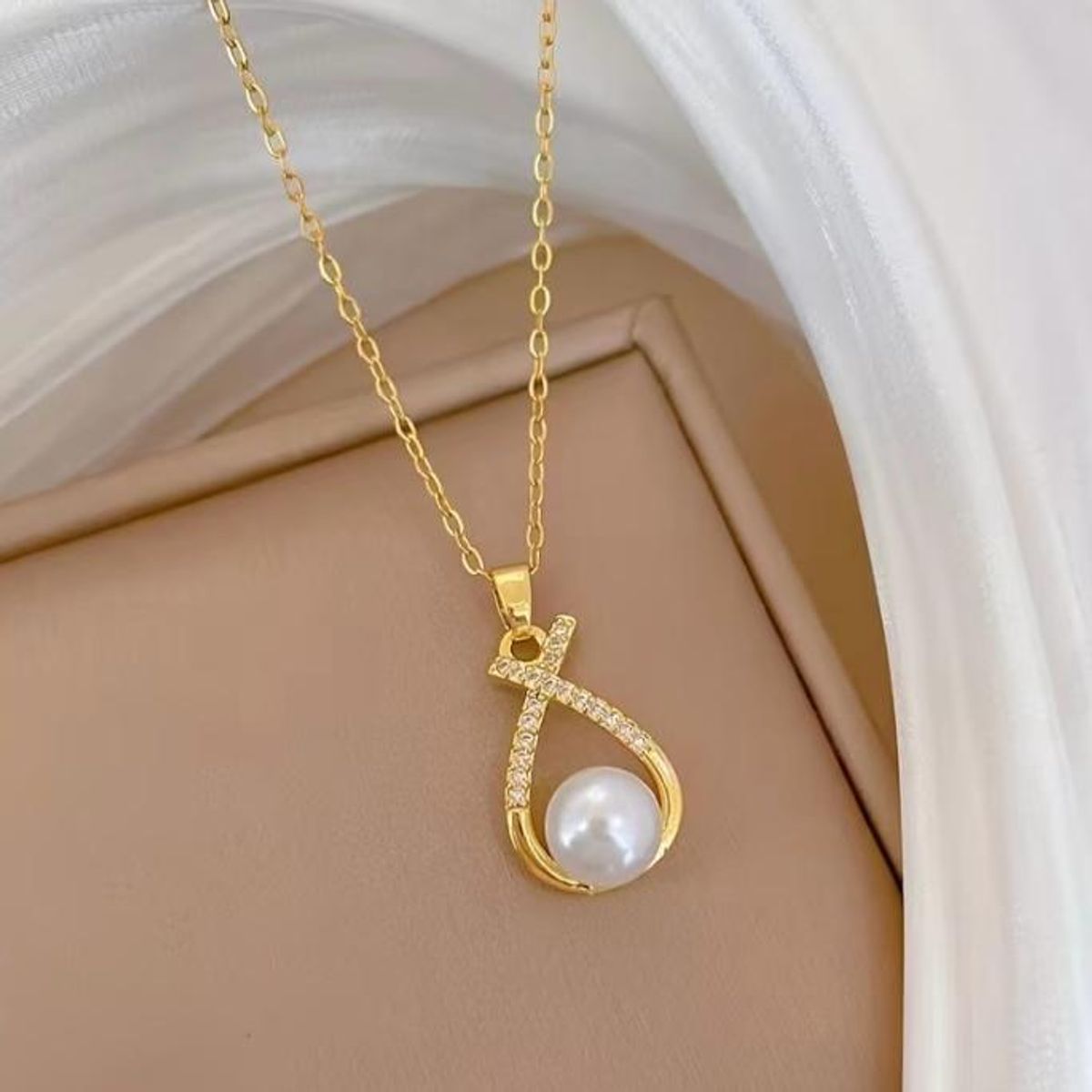 GENERICO - Collar y aretes perla en infinito