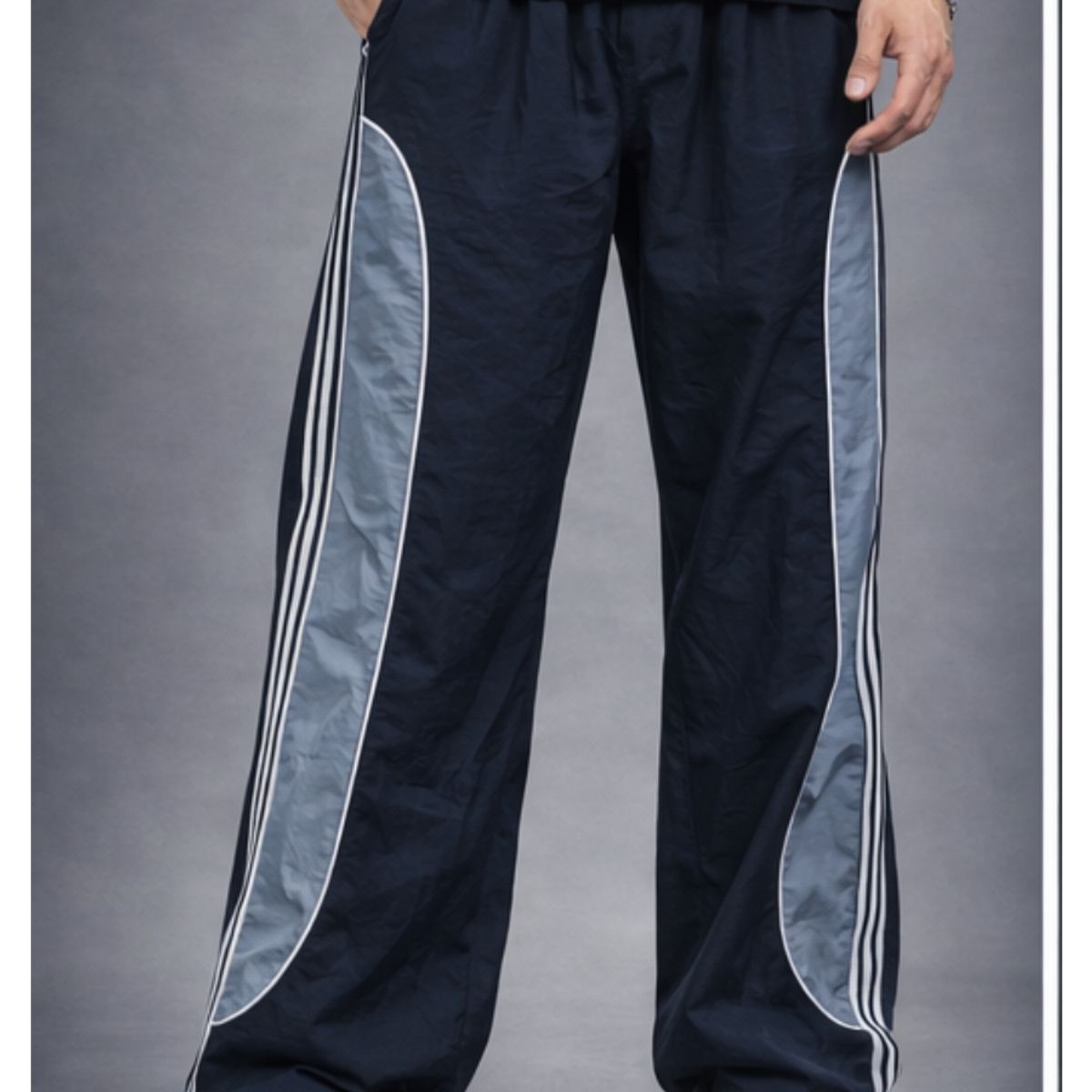 ENKI - Pantalón Power Track Oversized Tela Mojada Negro Hombre