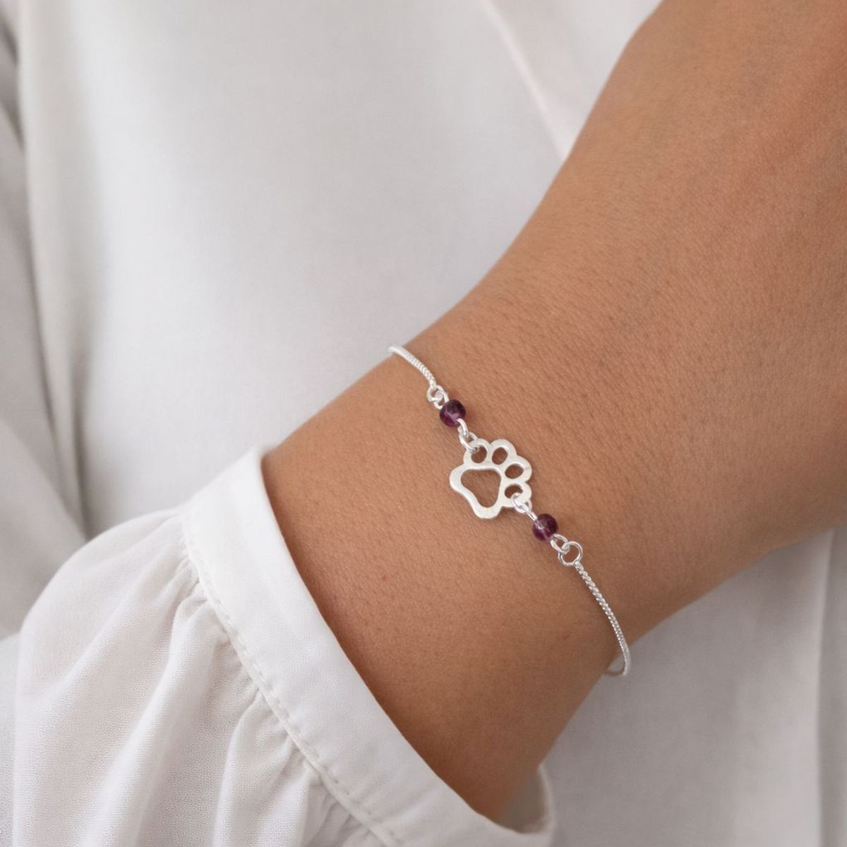 JOYERIA D'PILMER - PULSERA DE PLATA HUELLITA CON CRISTAL COLOR UVA