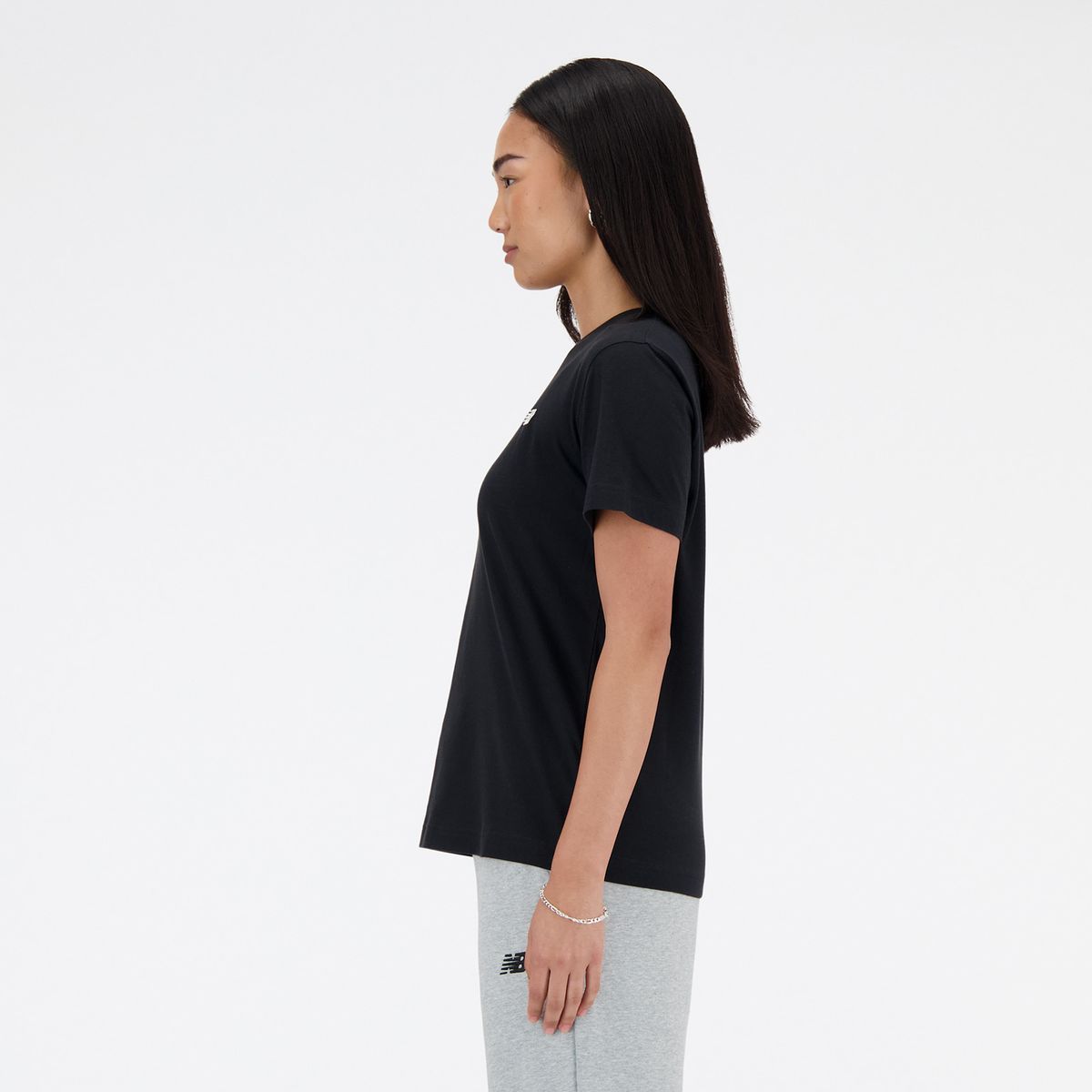 NEW BALANCE - Polo Mujer Sport Essentials Jersey Negro