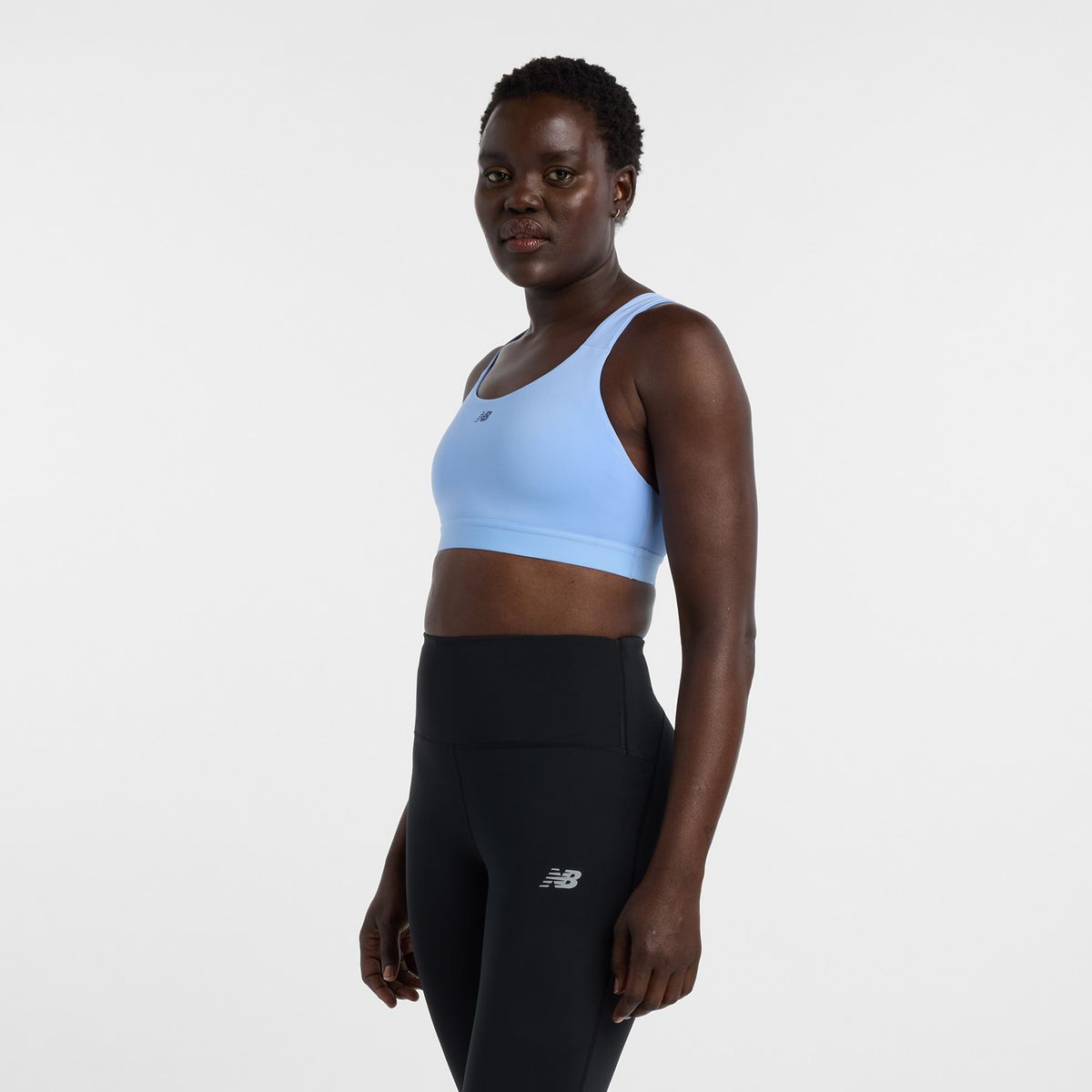 NEW BALANCE - Top Deportivo Mujer Nb Essential Train Celeste