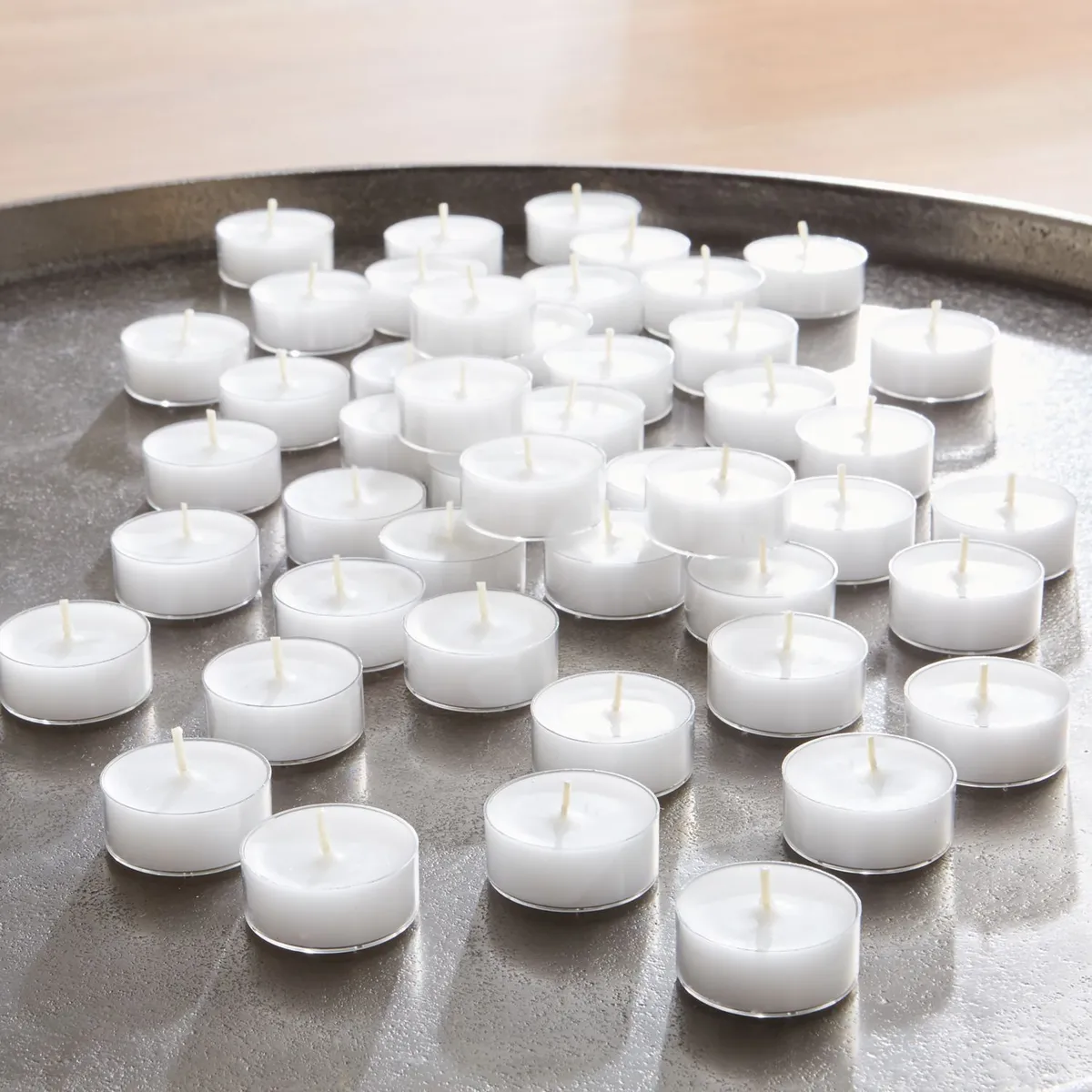 CRATE & BARREL - Juego de 50 Tealights de 3hrs. Blancas en Copa Transparente