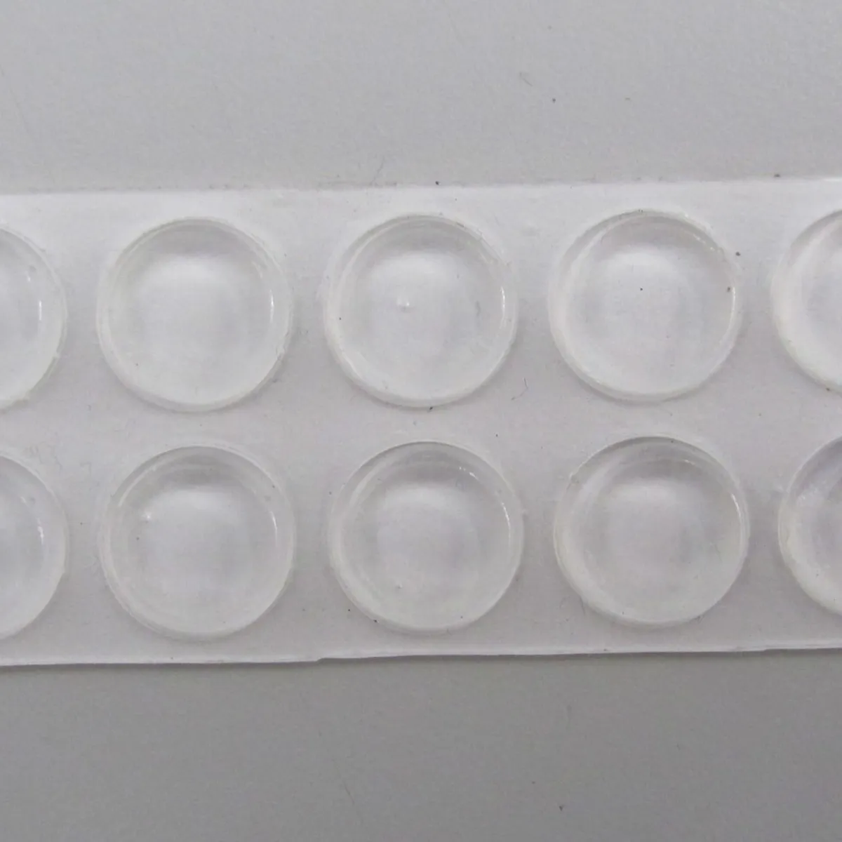 Adesivo de Silicone para Móveis com 10 Peças Incolor, marca Fixser - Foto Principal