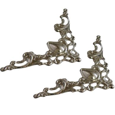 Esquinero decorativo 42 x 42 mm plateado 2 unid