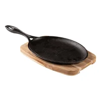 Tabla Tramontina Grill Ovalada de Hierro Fundido con Base y Mango de Madera 38.5x19cm