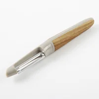 Pelador de verduras de acero inoxidable y silicona